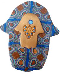 Picture of Hamsa with gold inlay and Czech crystal.